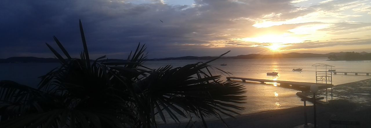 High angle view of calm sea at sunset