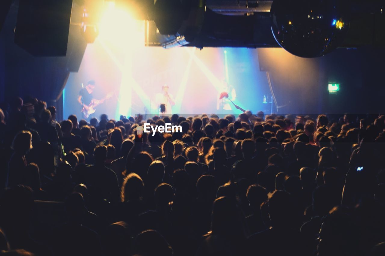 PEOPLE ENJOYING MUSIC CONCERT