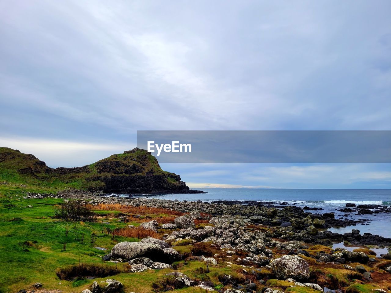 sky, water, sea, rock, coast, land, shore, cloud, ocean, scenics - nature, beauty in nature, beach, body of water, nature, landscape, horizon, environment, tranquility, no people, cliff, travel destinations, bay, tranquil scene, coastline, travel, outdoors, non-urban scene, horizon over water, day, tourism, cove, idyllic, seascape, trip, plant, overcast, mountain, terrain