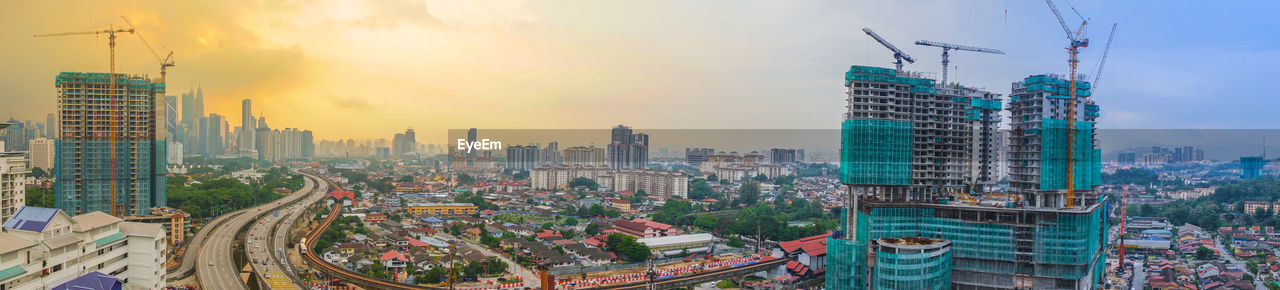 High angle view of city buildings during sunset