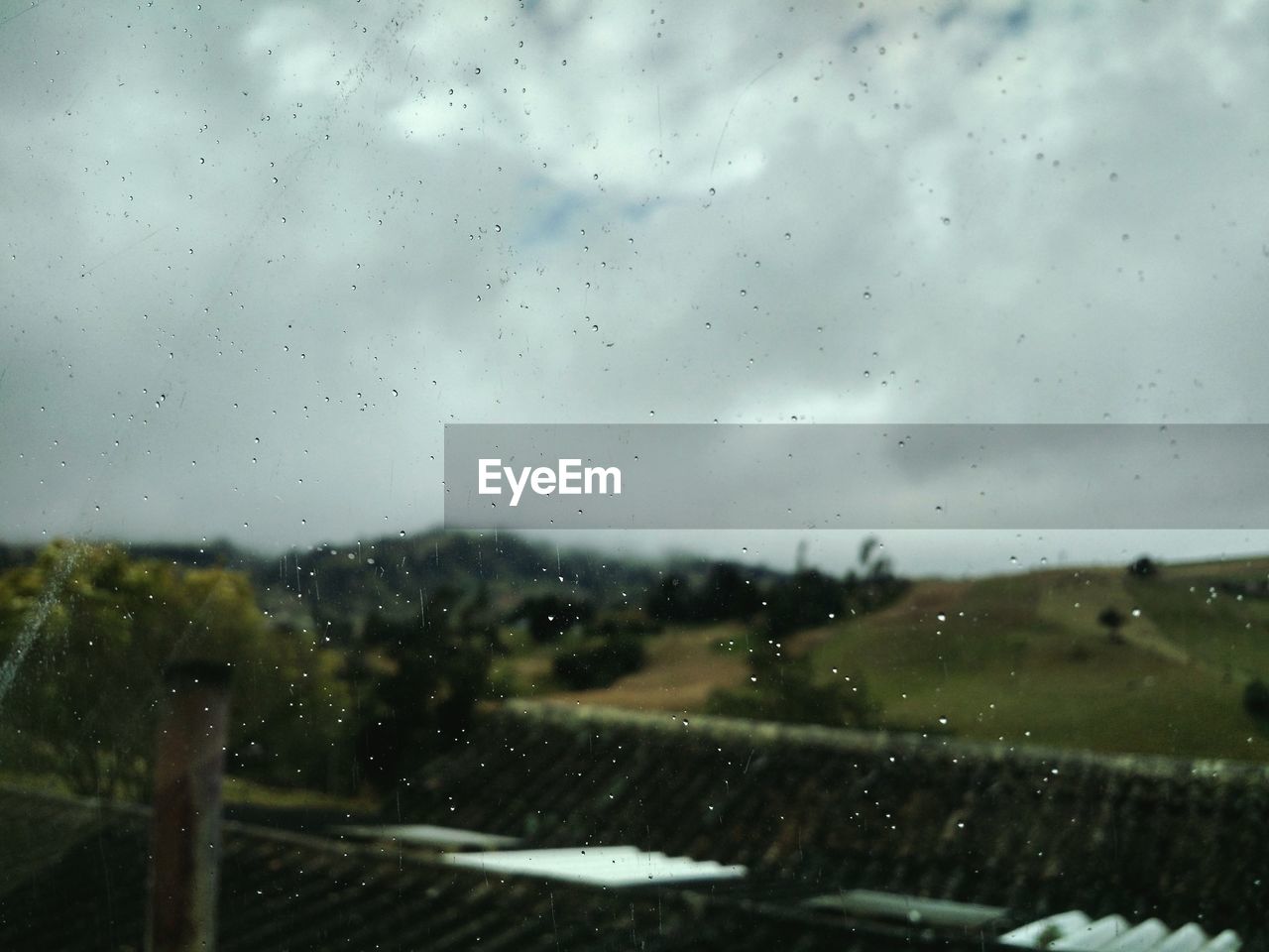 RAIN DROPS ON GLASS WINDOW