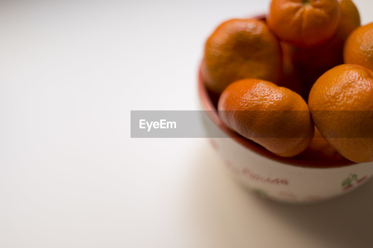 Close-up of fruits in bowl on table