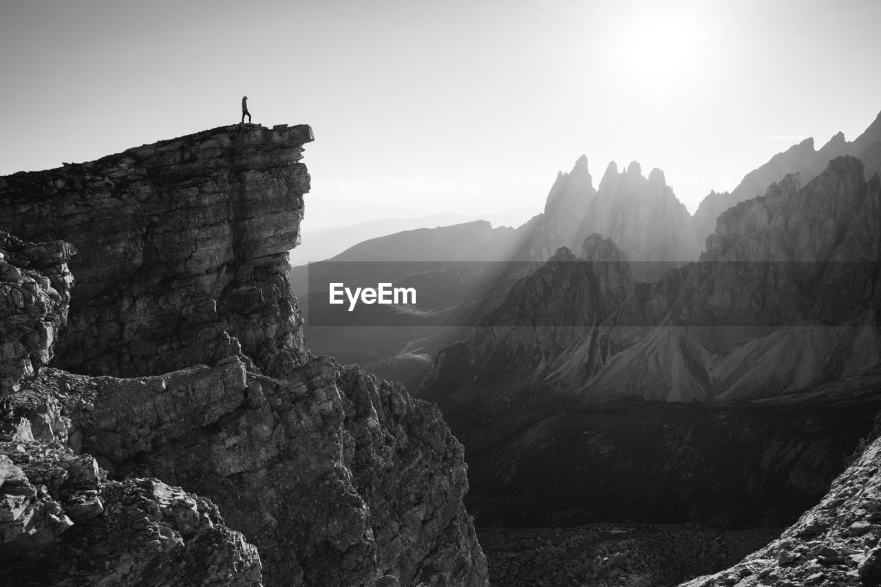 Man on mountain against sky