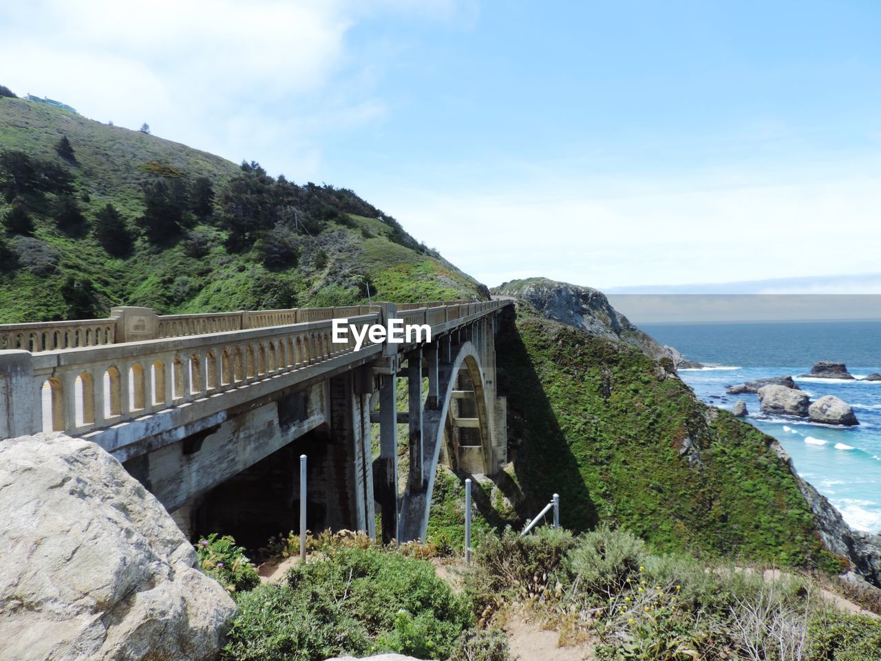 BRIDGE BY SEA AGAINST SKY