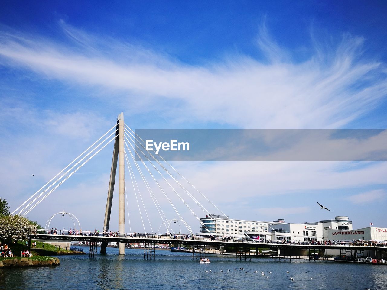 Bridge over sea against sky