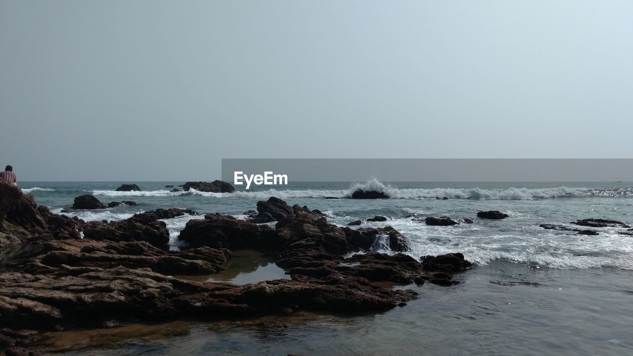 Scenic view of sea against clear sky