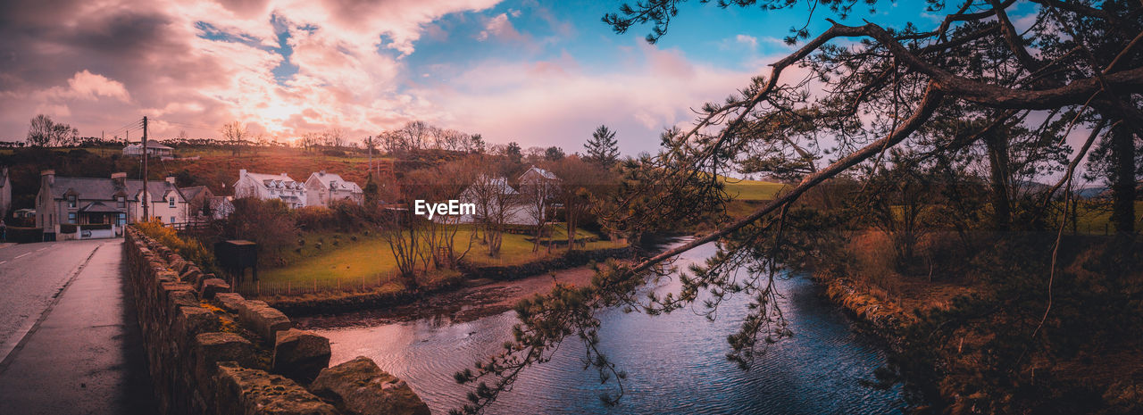 Beautiful panoramic view of cushendun's glendun river from over the bridge during sunset