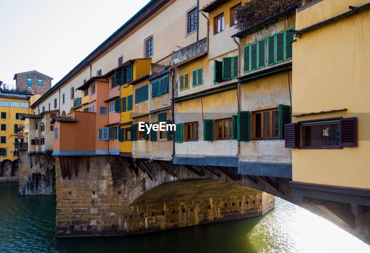 View of bridge over river in city