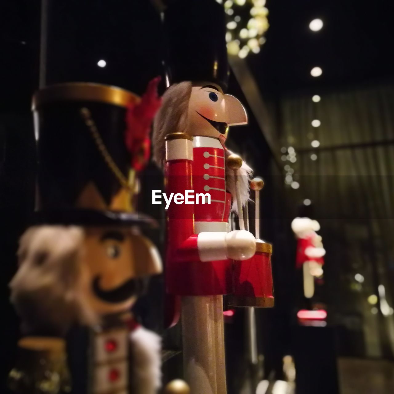 CLOSE-UP OF CHRISTMAS DECORATIONS HANGING ON TABLE