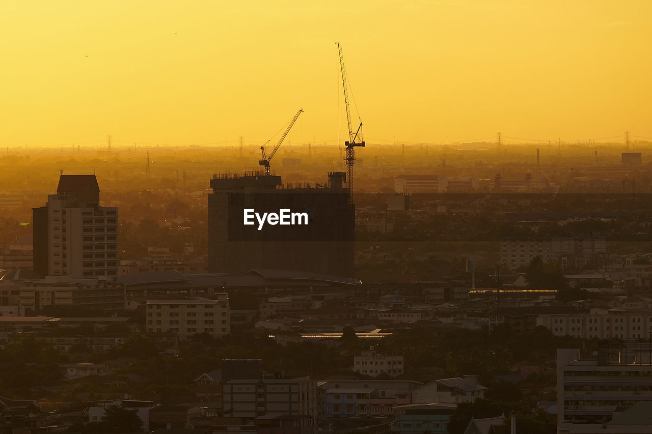 BUILDINGS AGAINST SKY DURING SUNSET