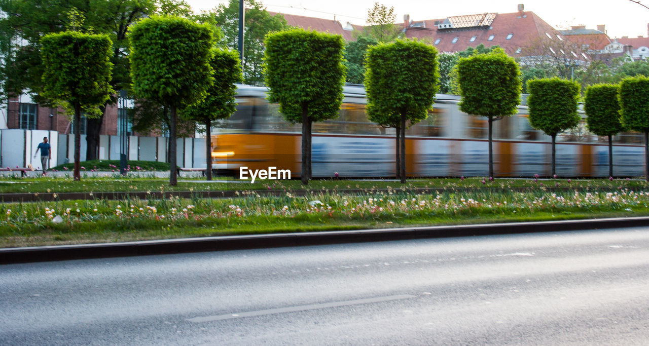 Blurred motion of train in town