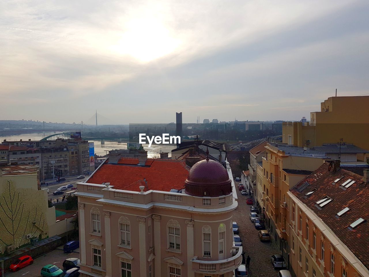 HIGH ANGLE VIEW OF BUILDINGS AGAINST SKY