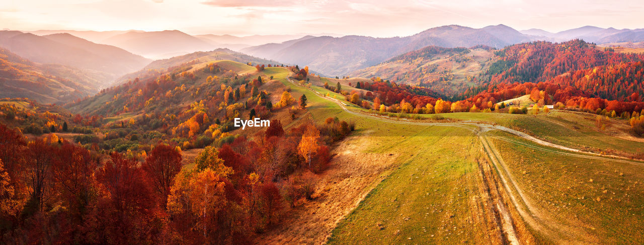 Scenic view of landscape against sky during autumn