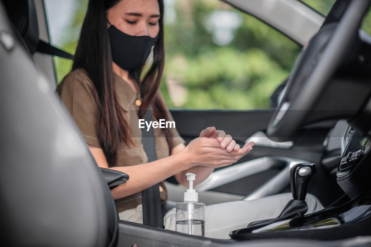 Woman sitting in car