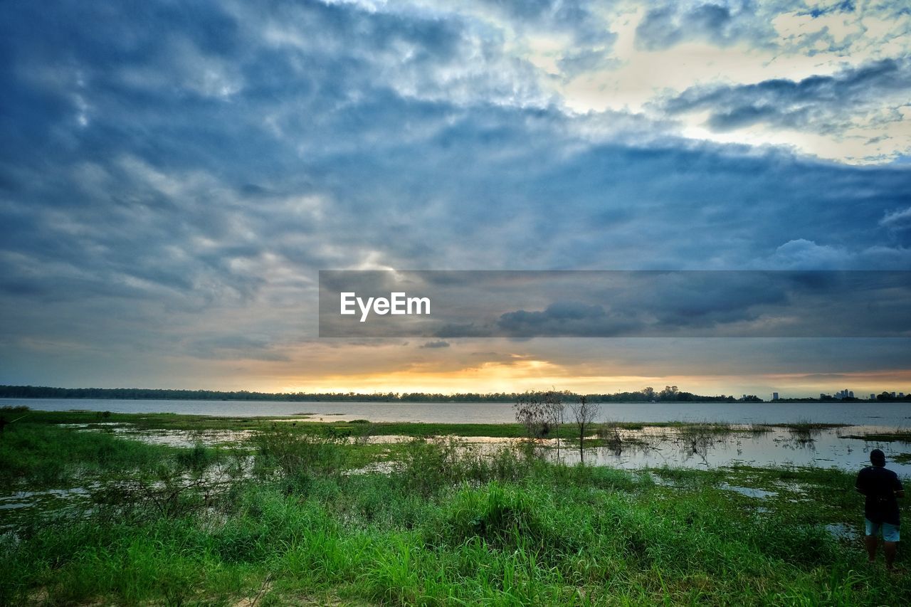 SCENIC VIEW OF SUNSET OVER LAND