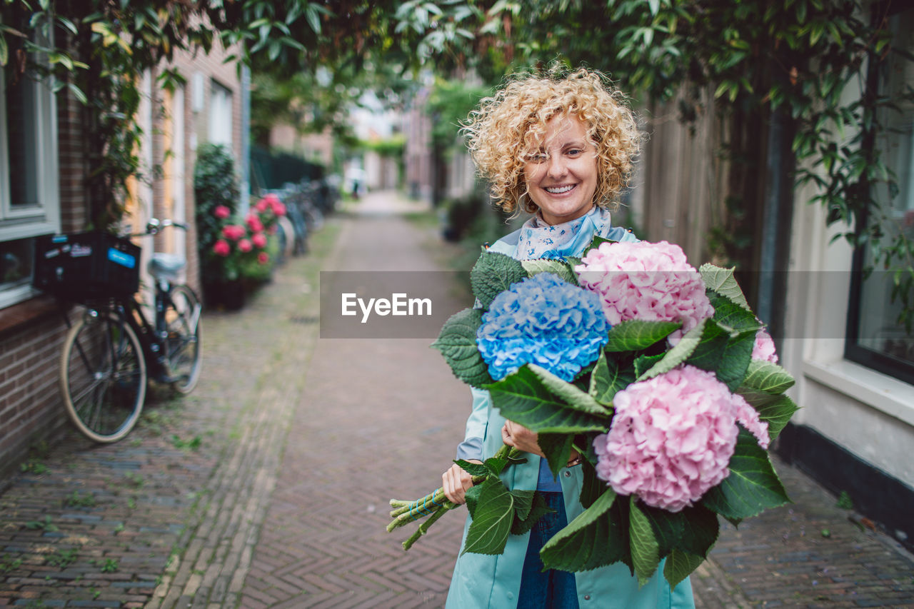 portrait of young woman with flowers