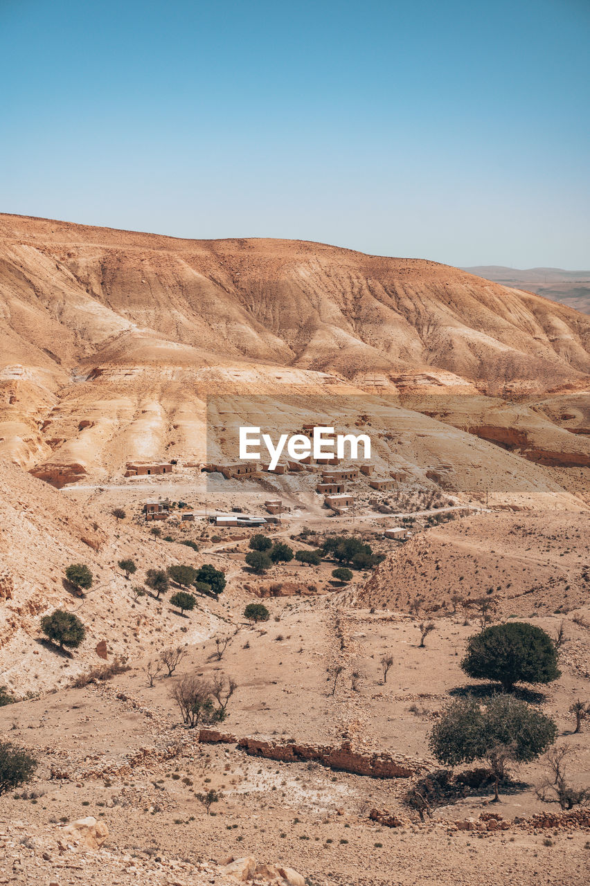 Rock formations in desert against clear sky