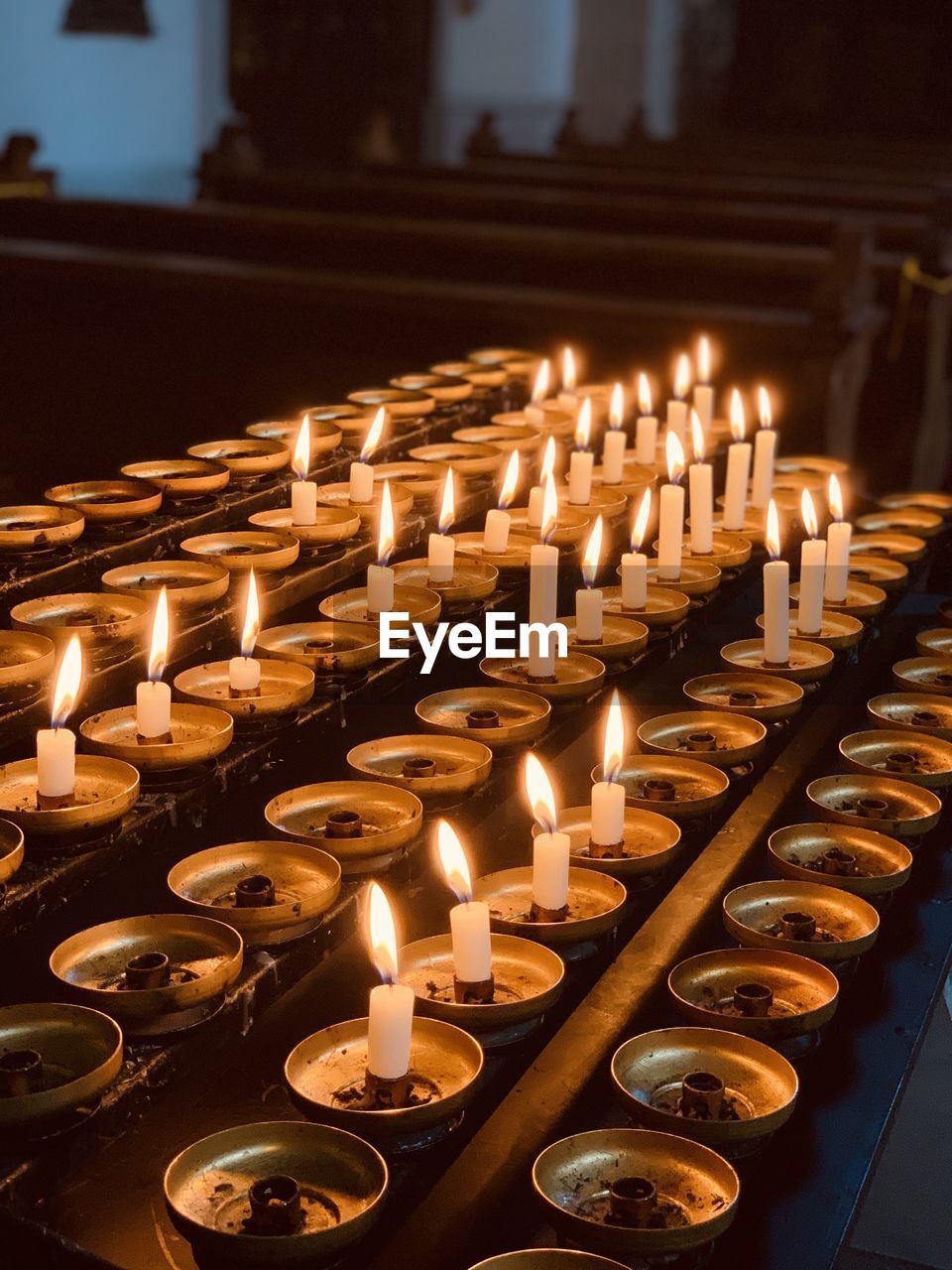 ILLUMINATED CANDLES IN TEMPLE