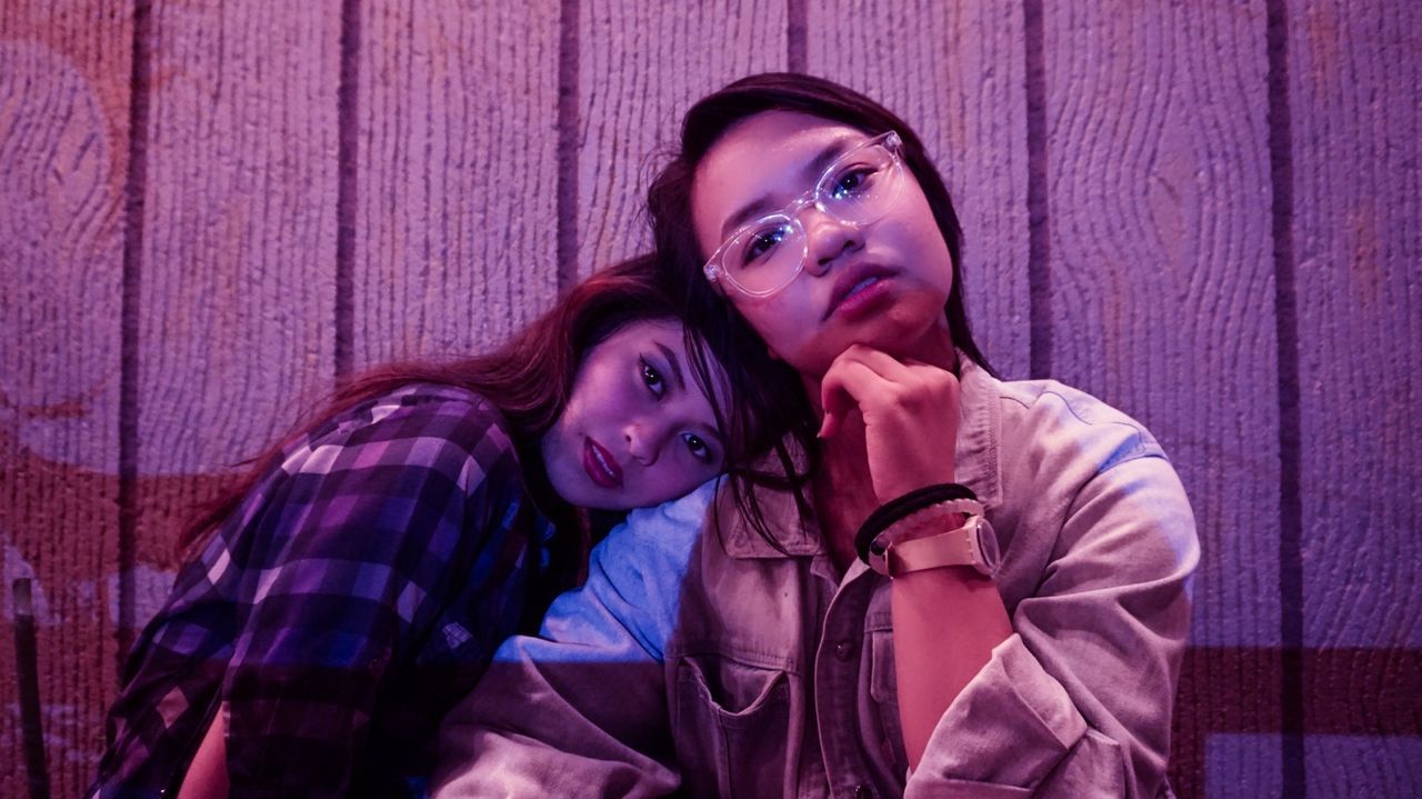 Portrait of young women sitting indoors