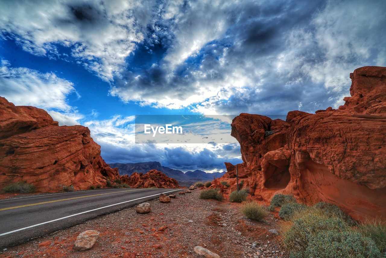 Panoramic view of road and mountains against sky