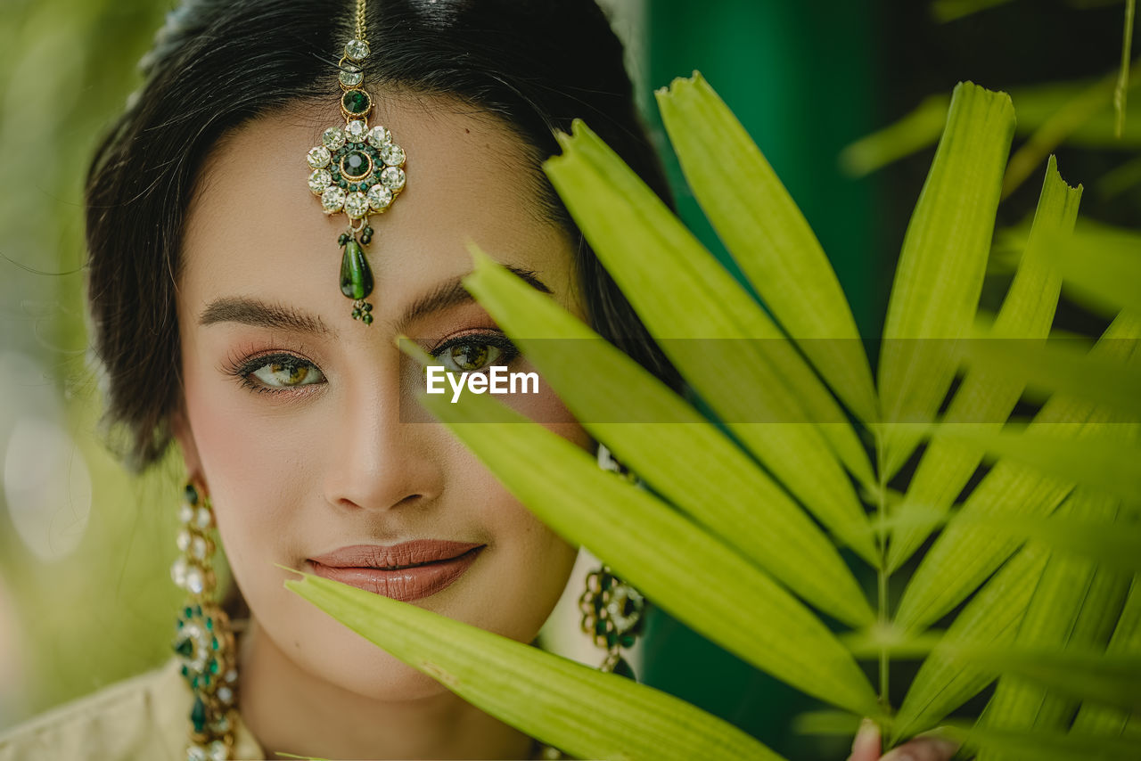 CLOSE-UP PORTRAIT OF A YOUNG WOMAN WITH EYES