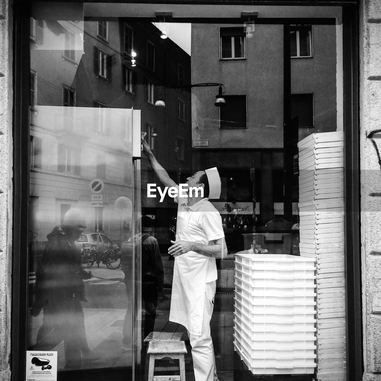 WOMAN STANDING IN FRONT OF BUILDING