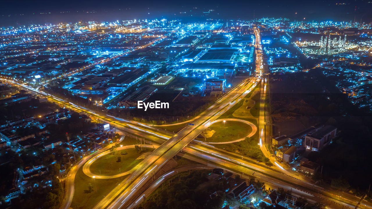 Twilight landscape ring road inter city and lightning cityscape background at night aerial view 