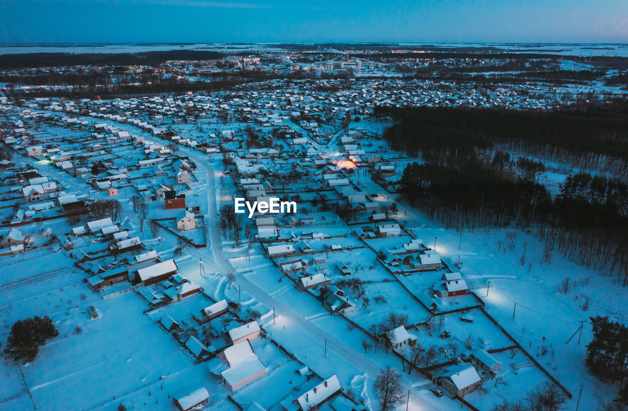 high angle view of illuminated buildings in city