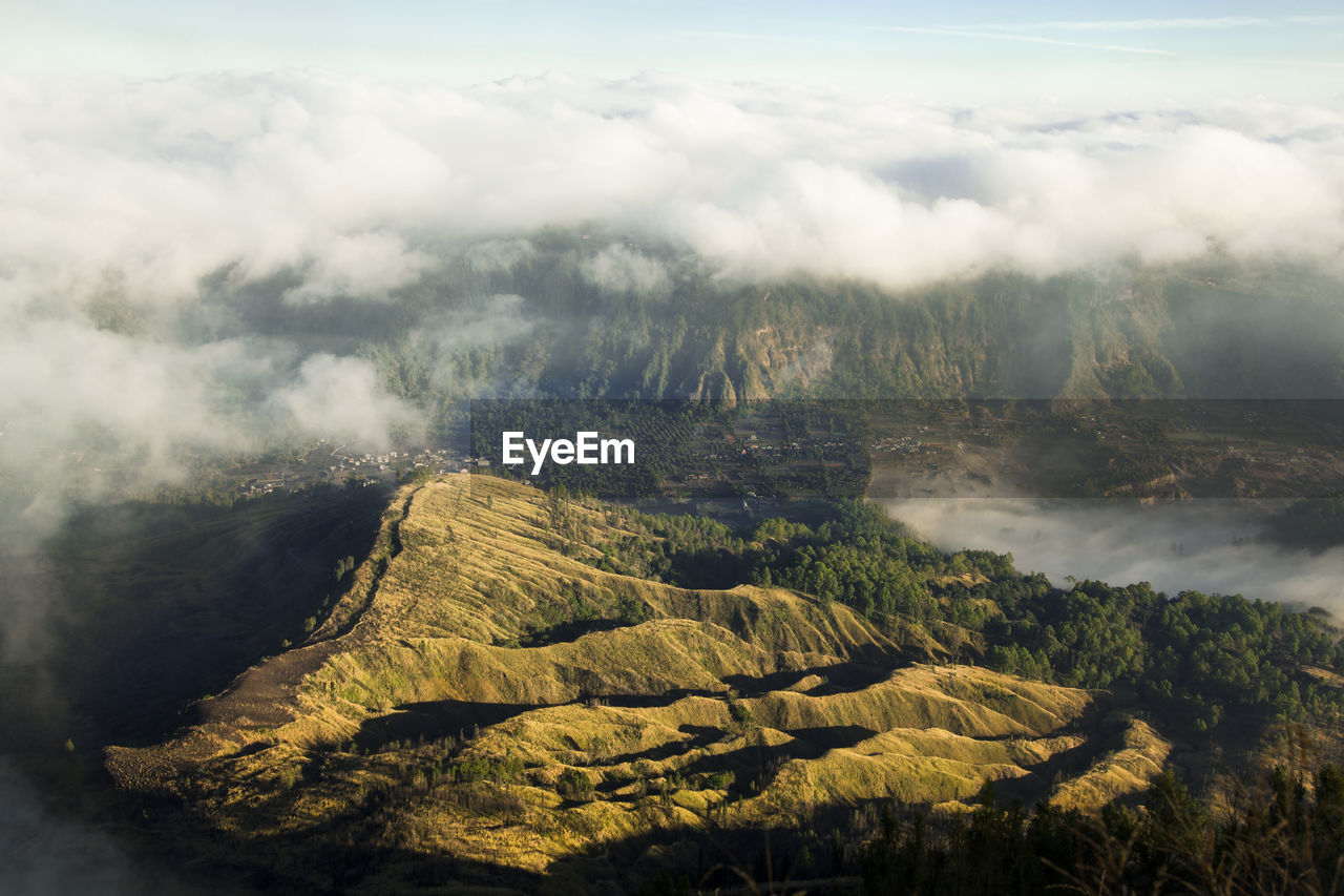 High angle view of hills against cloudy sky at sunrise, batur volcano bali indonesia