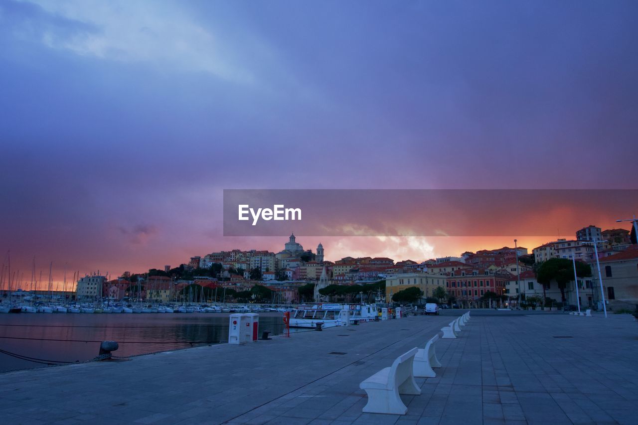 Panoramic view of city against sky at sunset