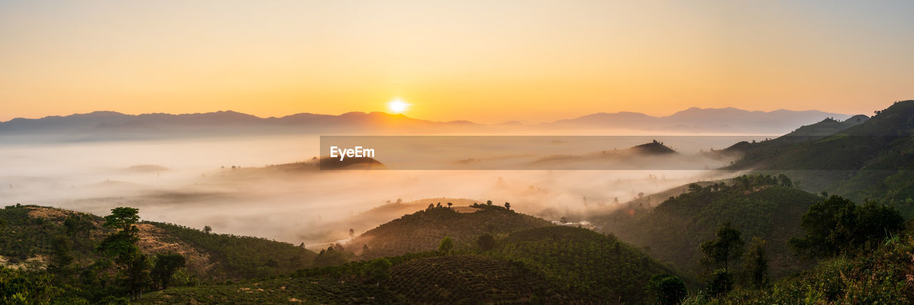 Scenic view of mountains against sky during sunset