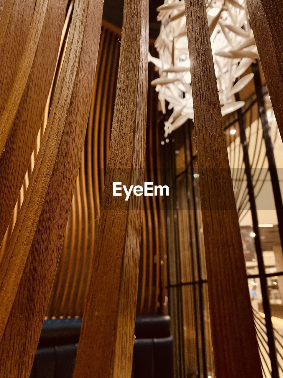 LOW ANGLE VIEW OF DECORATIONS HANGING ON CEILING IN BUILDING