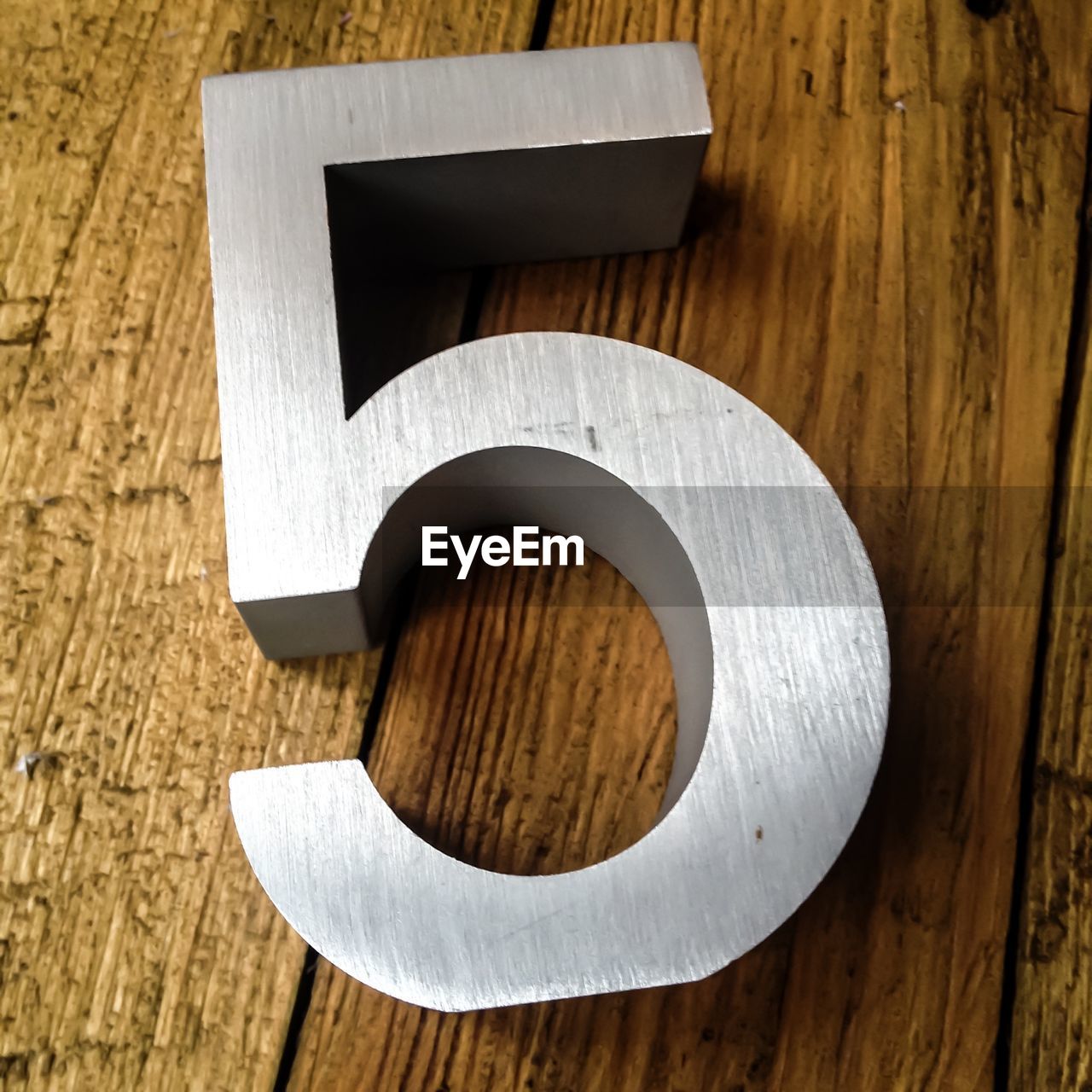 High angle view of number on wooden table