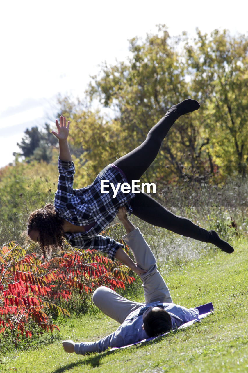 Woman excercising in field