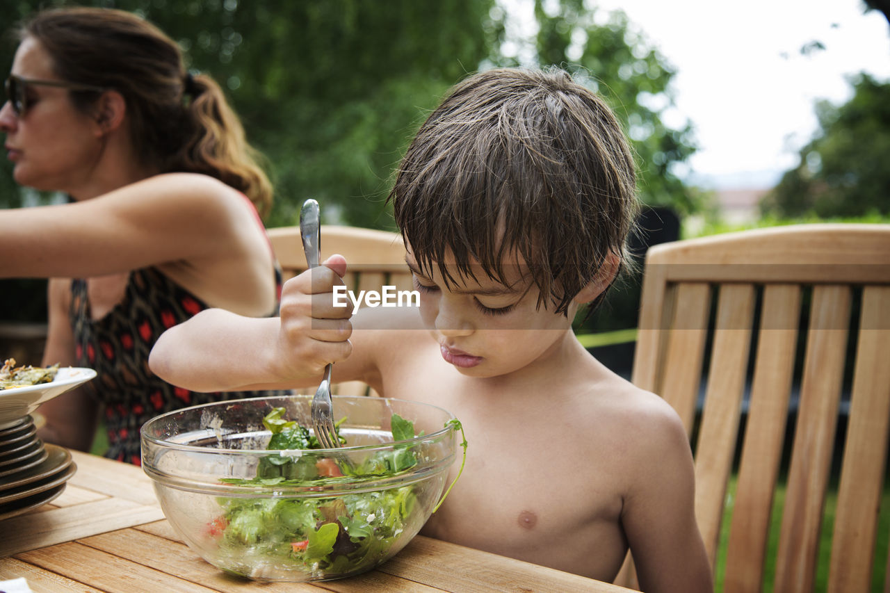 Boy eating salad