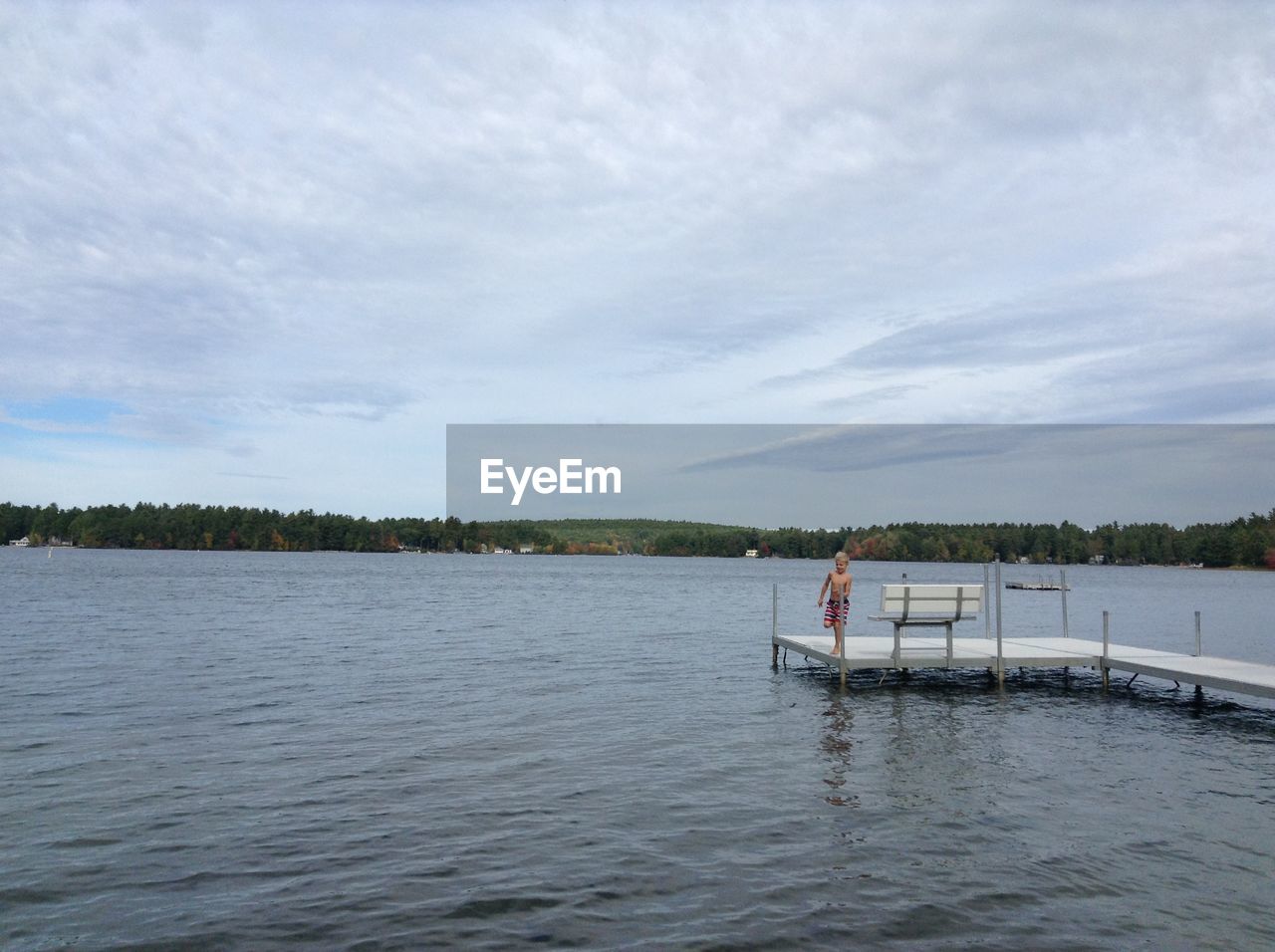 VIEW OF LAKE AGAINST CLOUDY SKY