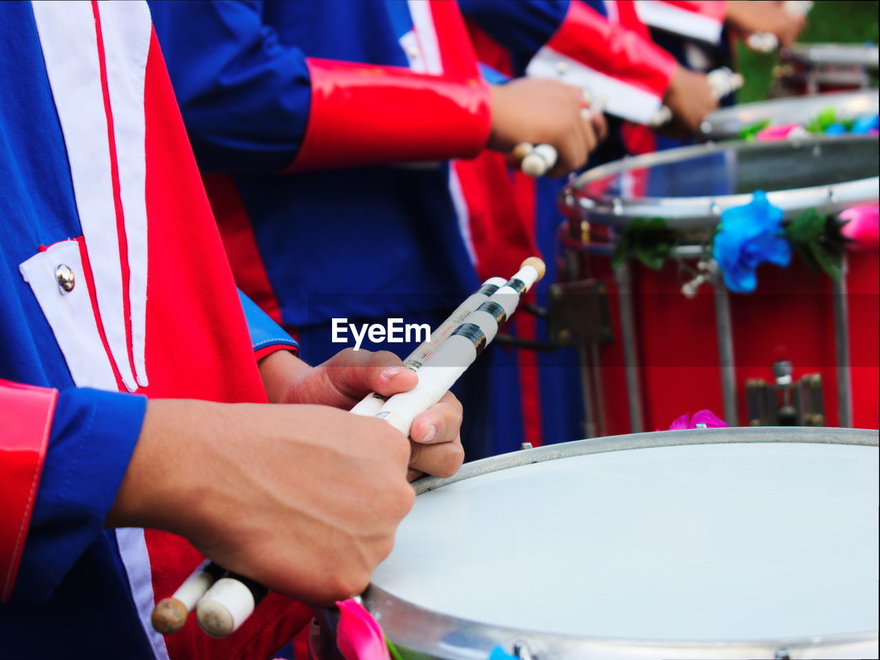 Close-up of hands playing drums