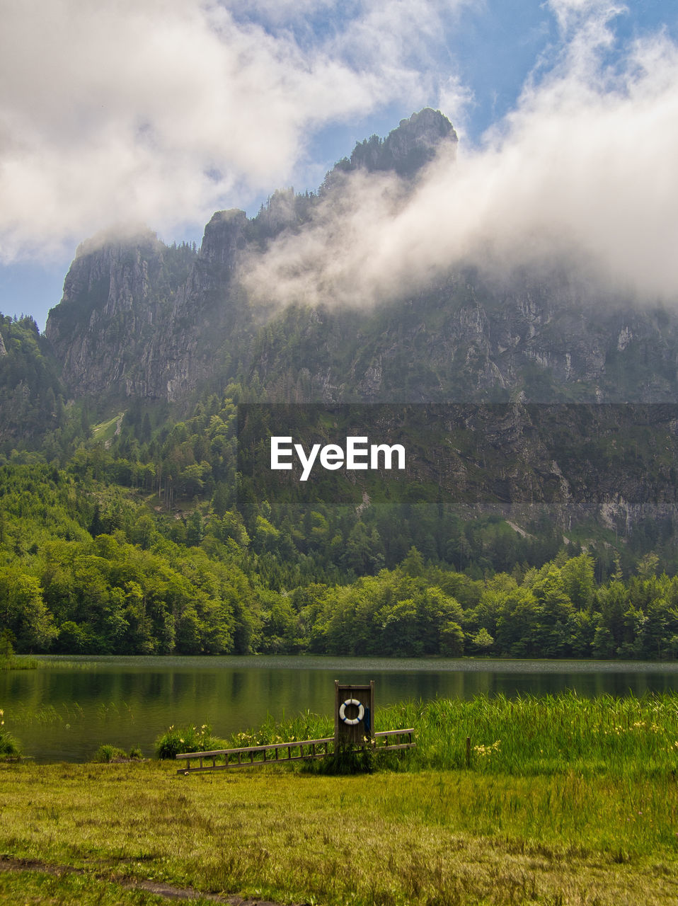 Scenic view of land and mountains against sky