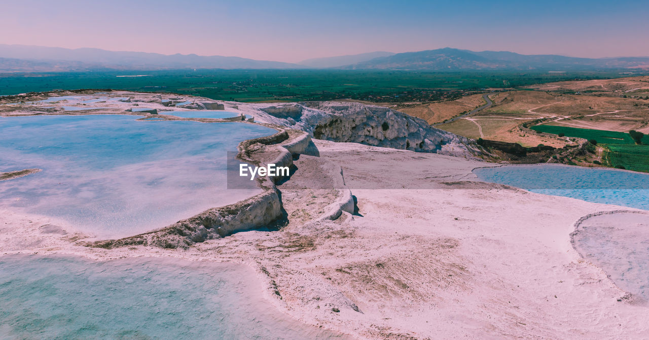 Scenic view of landscape and mountains against sky