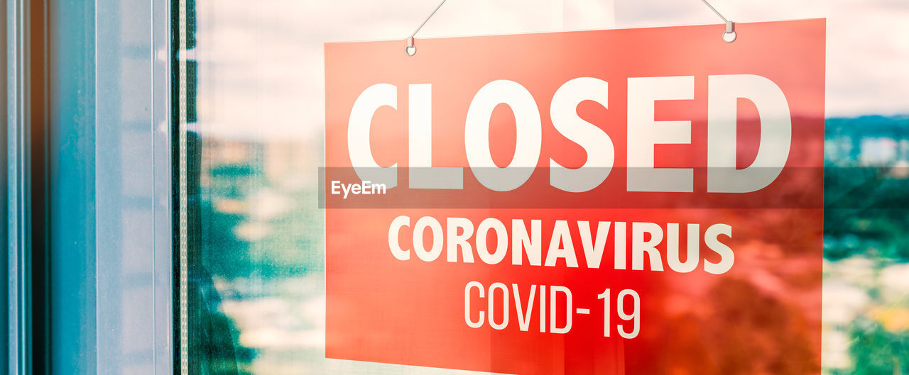 Sign with the word closed in the window of a store due to the coronavirus pandemic