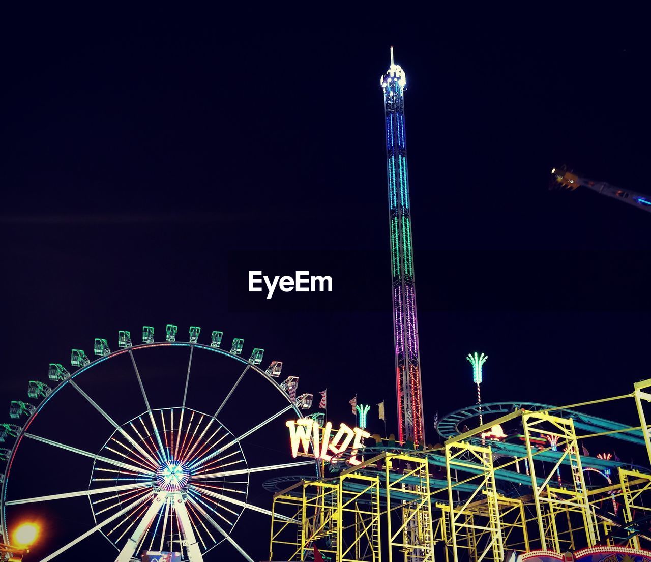 LOW ANGLE VIEW OF FERRIS WHEEL AGAINST SKY