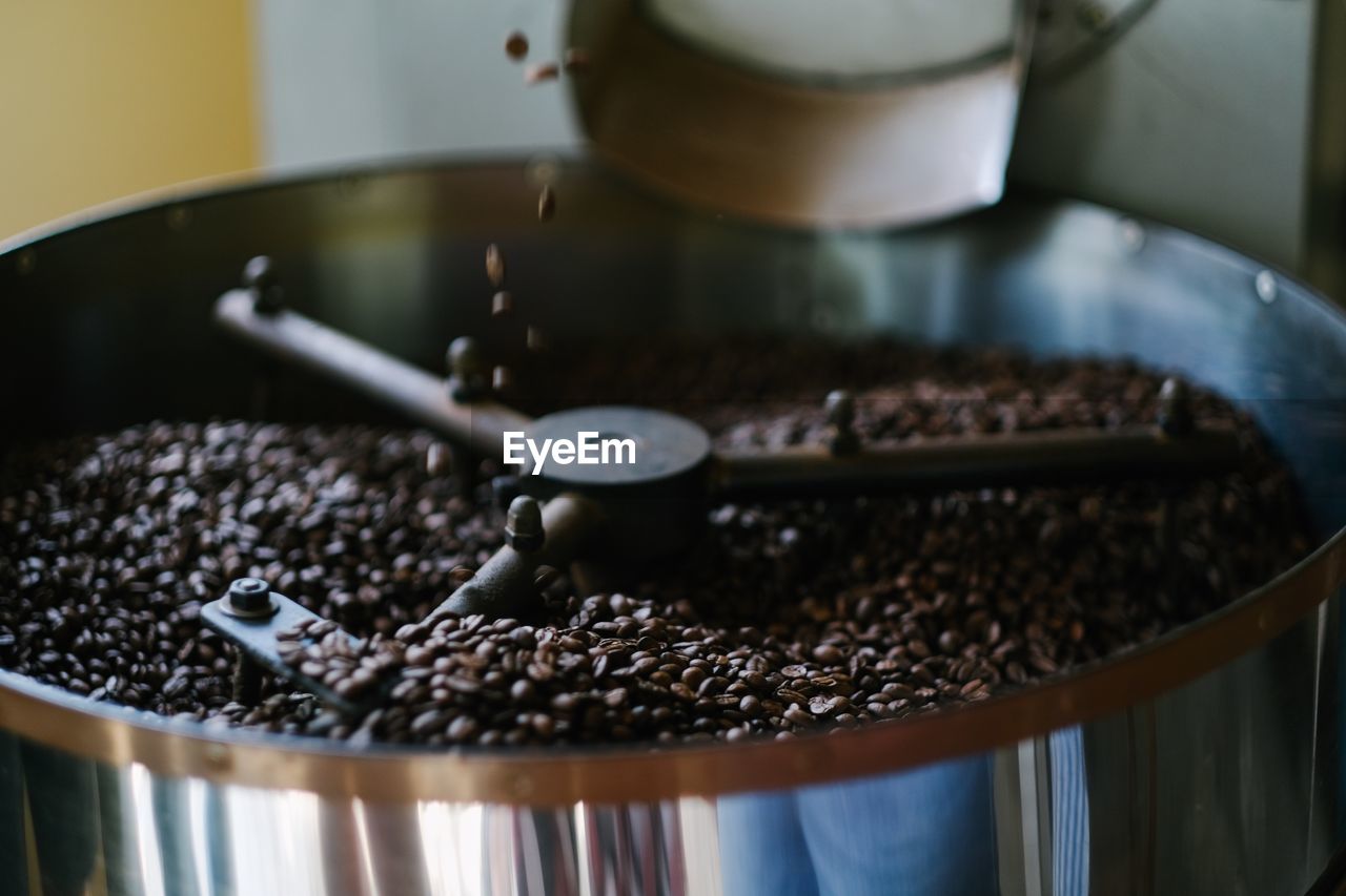 Close-up of roasted coffee beans in container