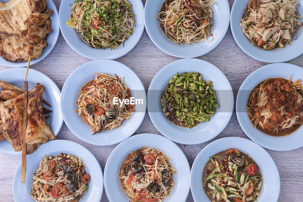 Papaya salad is a traditional food of the northeastern region of thailand.