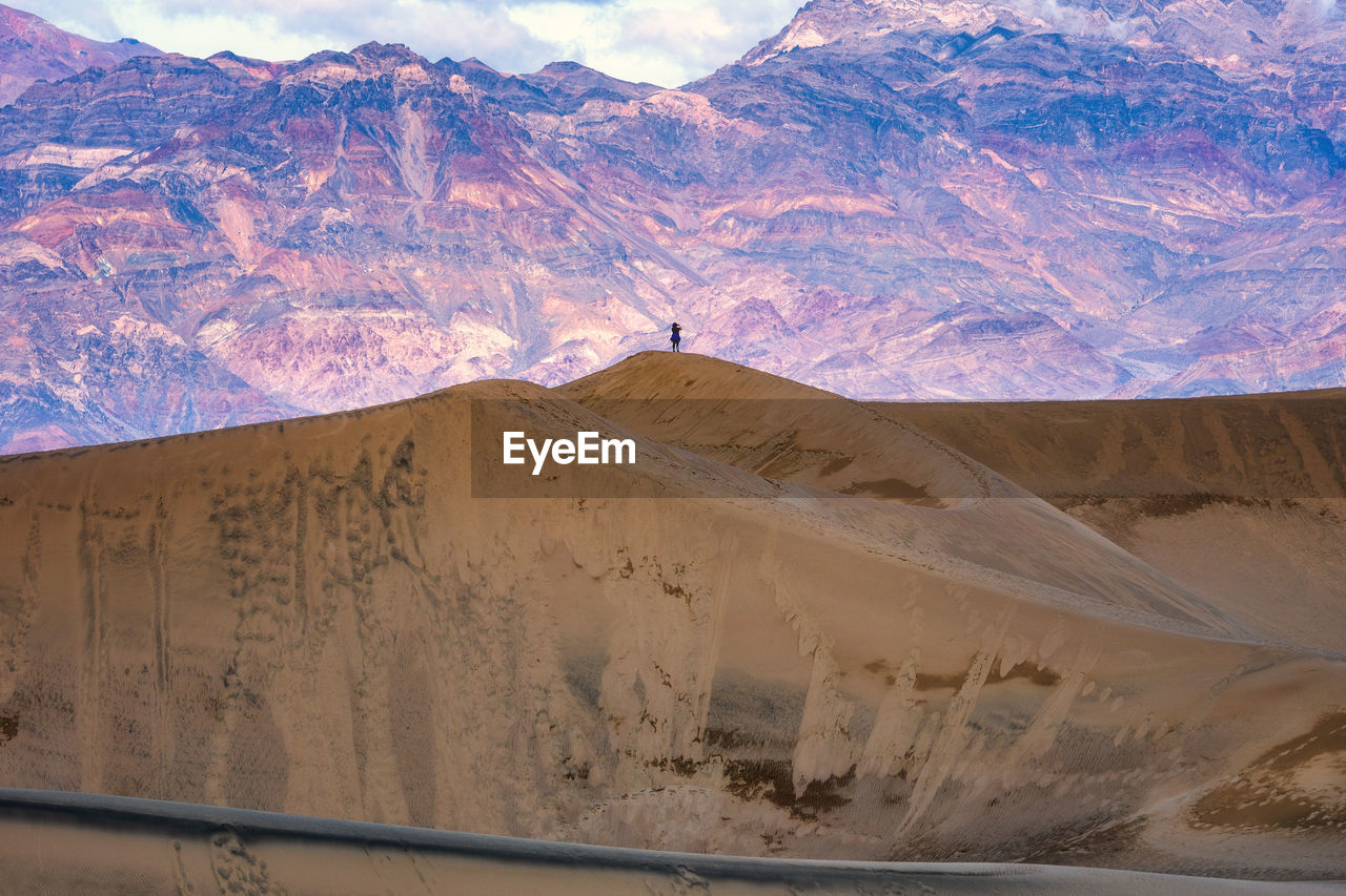 1 person standing on sand dune, death valley