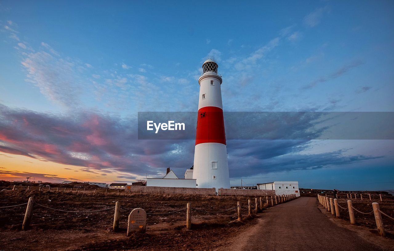 Lighthouse against sky during sunset