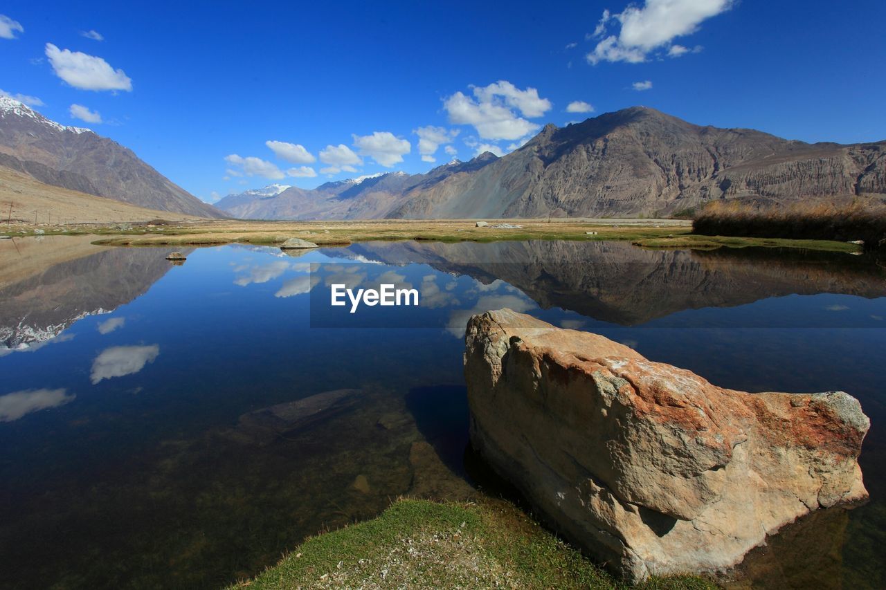 Scenic view of river with reflections in nubra valley