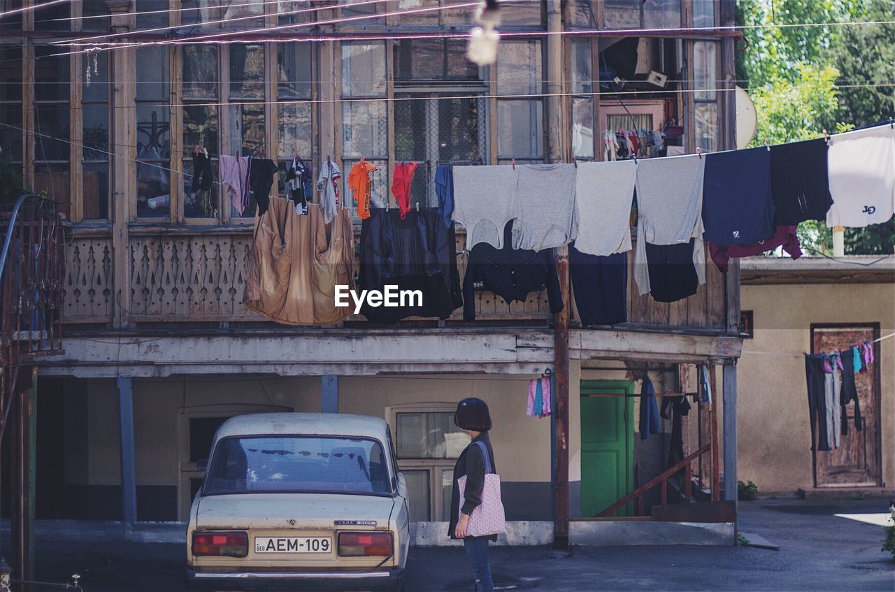 CLOTHES DRYING AGAINST BUILDING