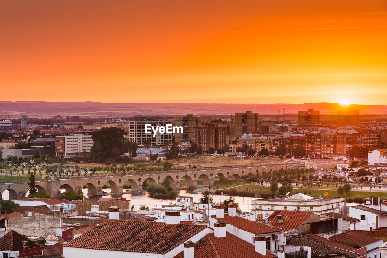 High angle view of city at sunset