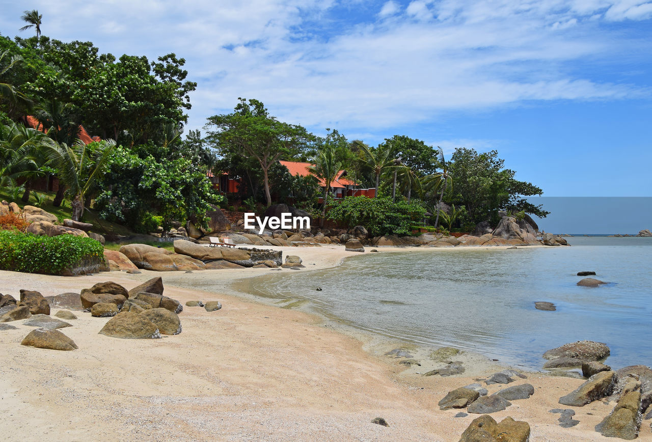 Scenic view of calm sea against cloudy sky