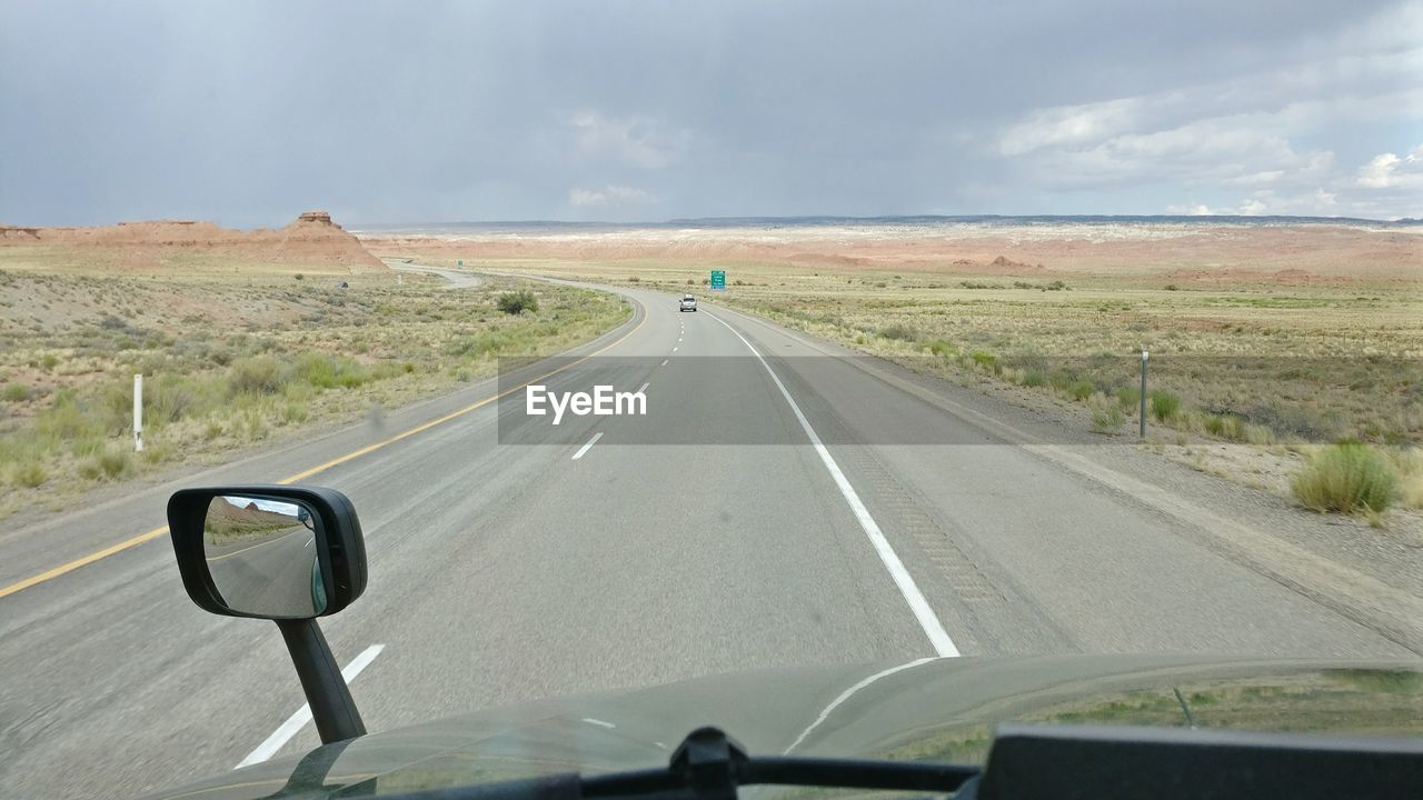 Car on highway against sky